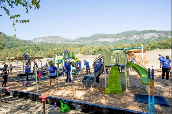 Volunteers Constructing Playground 101525